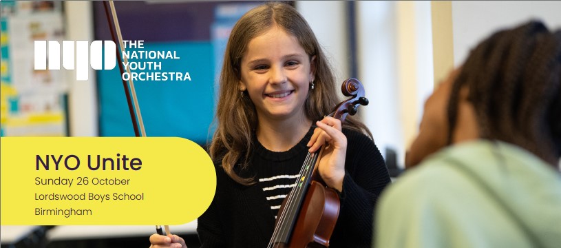 girl holding violin and smiling