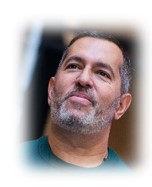 photo of a man loooking up thoughtully